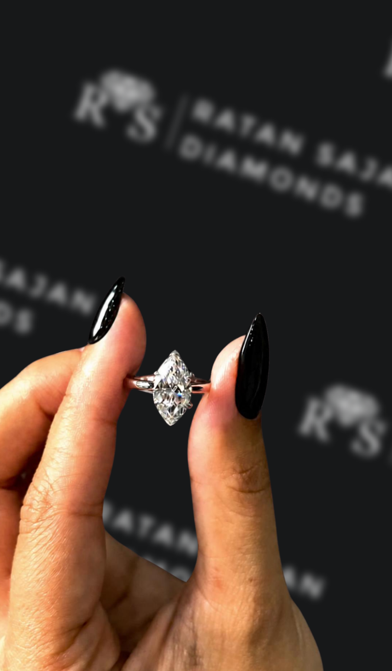 One-and-a-half carat marquise cut natural diamond solitaire engagement ring