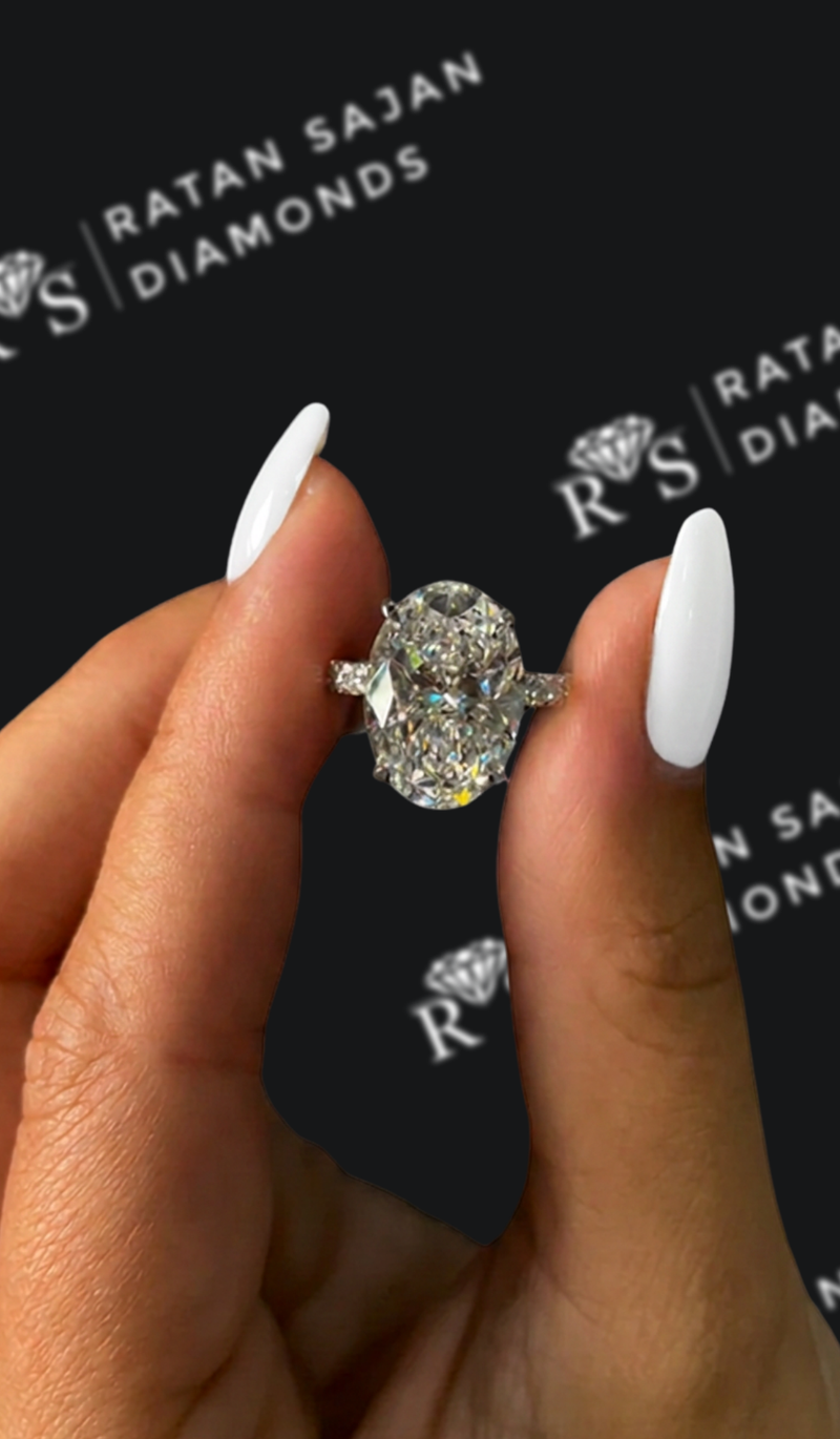 Five carat oval natural diamond band engagement ring in white gold