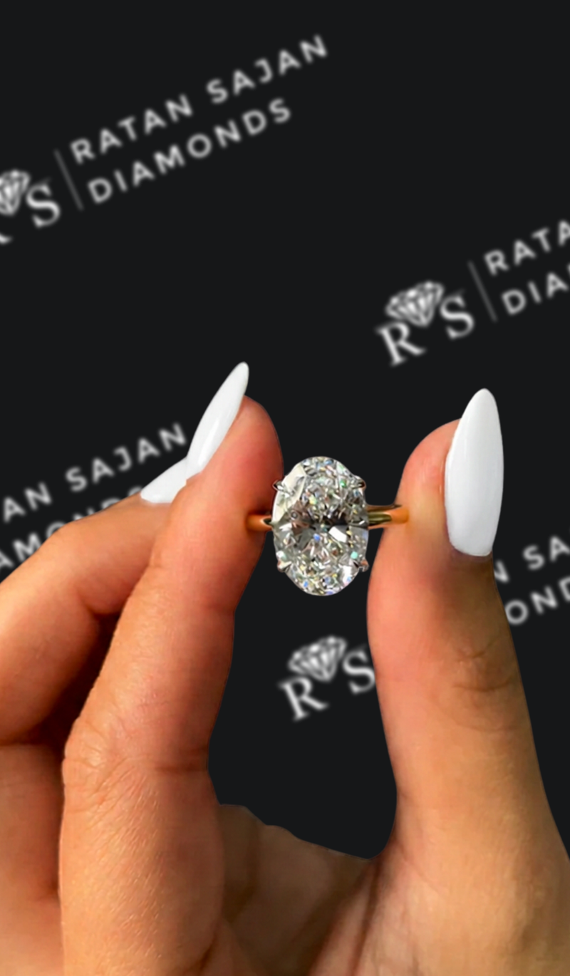 Four carat oval natural diamond solitaire engagement ring