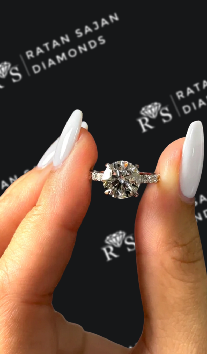One-and-a-half carat round brilliant natural diamond band engagement ring