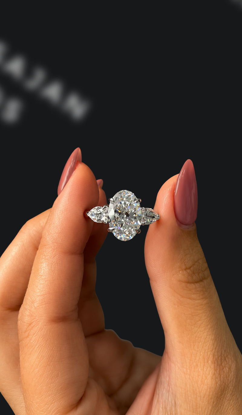 Two carat oval natural diamond trilogy engagement ring