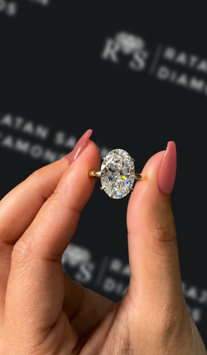 Five carat oval natural diamond solitaire engagement ring