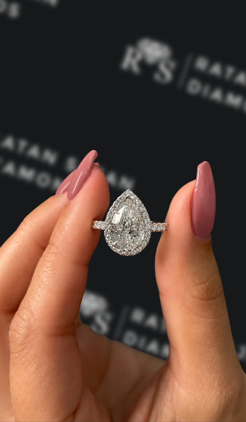 Two carat pear shaped natural diamond halo engagement ring