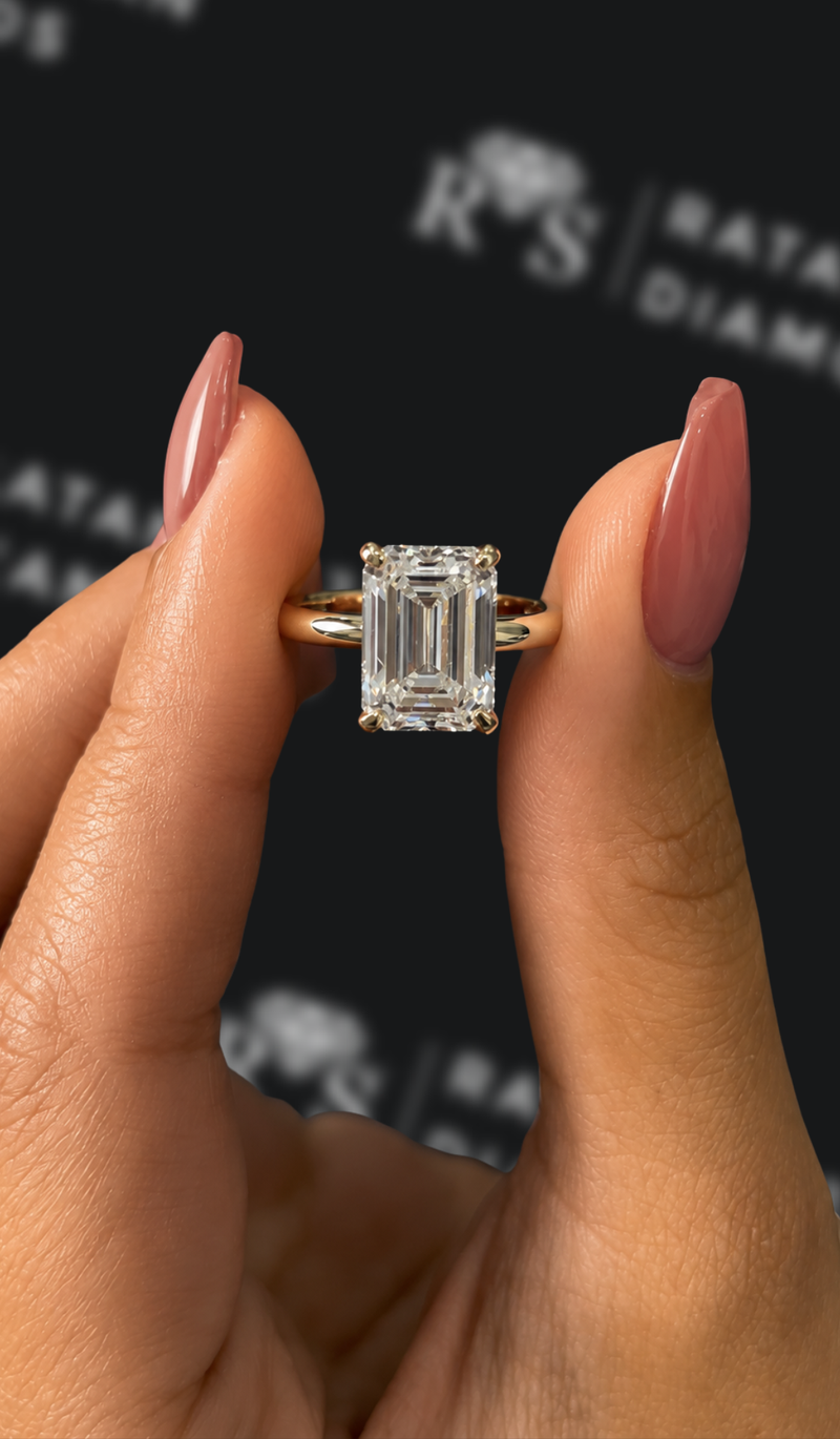 Four carat emerald cut natural diamond solitaire engagement ring