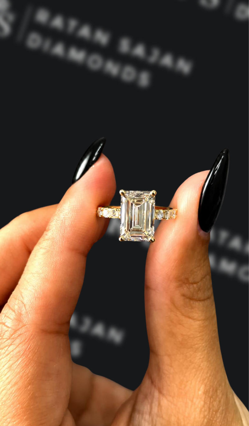 Two-and-a-half carat emerald cut natural diamond band engagement ring