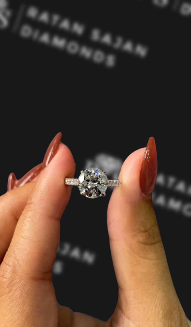 Five carat round brilliant natural diamond solitaire engagement ring
