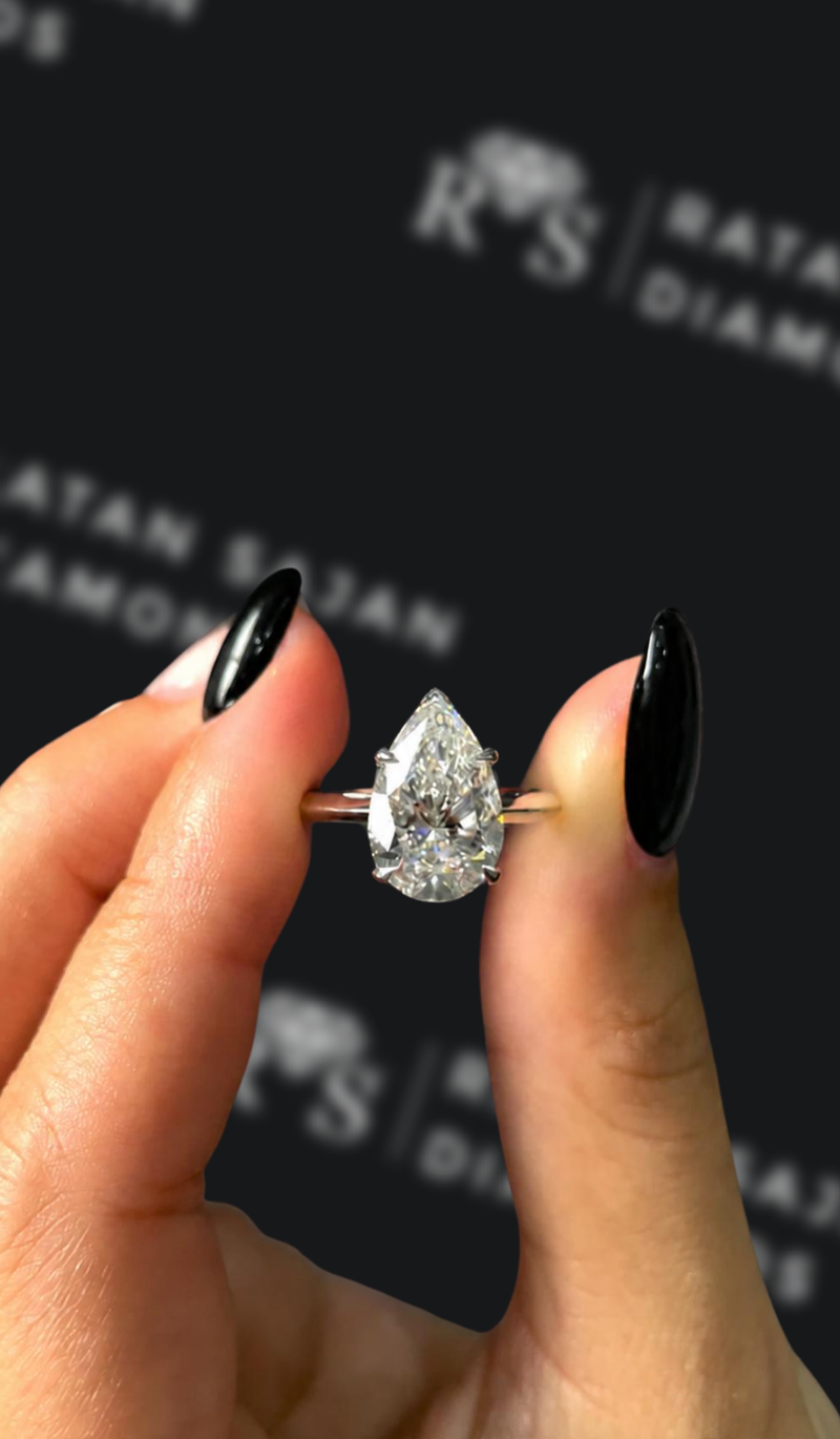Three carat pear shaped natural diamond solitaire engagement ring